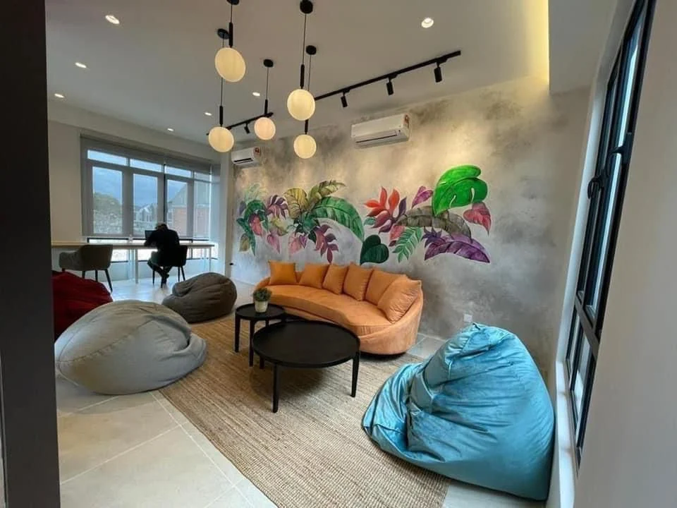 Forresta clubhouse residents lounge with tropical mural and bean bags